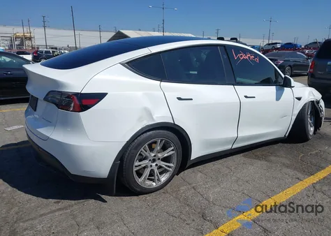 2023 Tesla Model Y Awd/Long Range Dual Motor All-Wheel Drive z USA, uszkodzony, nr VIN 7SAYGAEE0PF806900